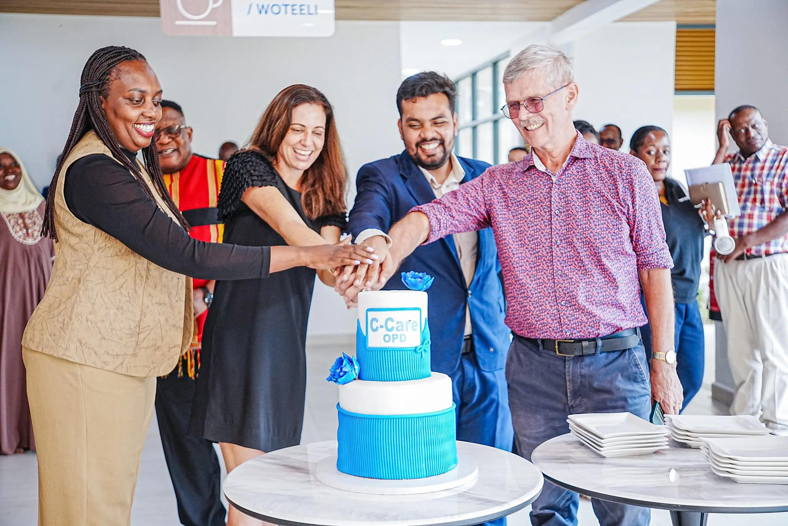 Ian Clarke,(1st R),founder of IHK joins Azhar Sundhoo,(2nd R),CEO C Care Uganda, Helen Echevin,(2nd L), CEO C Care Group and Dr Miriam Mutero, (1st L), General Manager C Care IHK to cut cake at the OPD Launch Ian Clarke,(1st R),founder of IHK joins Azhar Sundhoo,(2nd R),CEO C Care Uganda, Helen Echevin,(2nd L), CEO C Care Group and Dr Miriam Mutero, (1st L), General Manager C Care IHK to cut cake at the OPD Launch