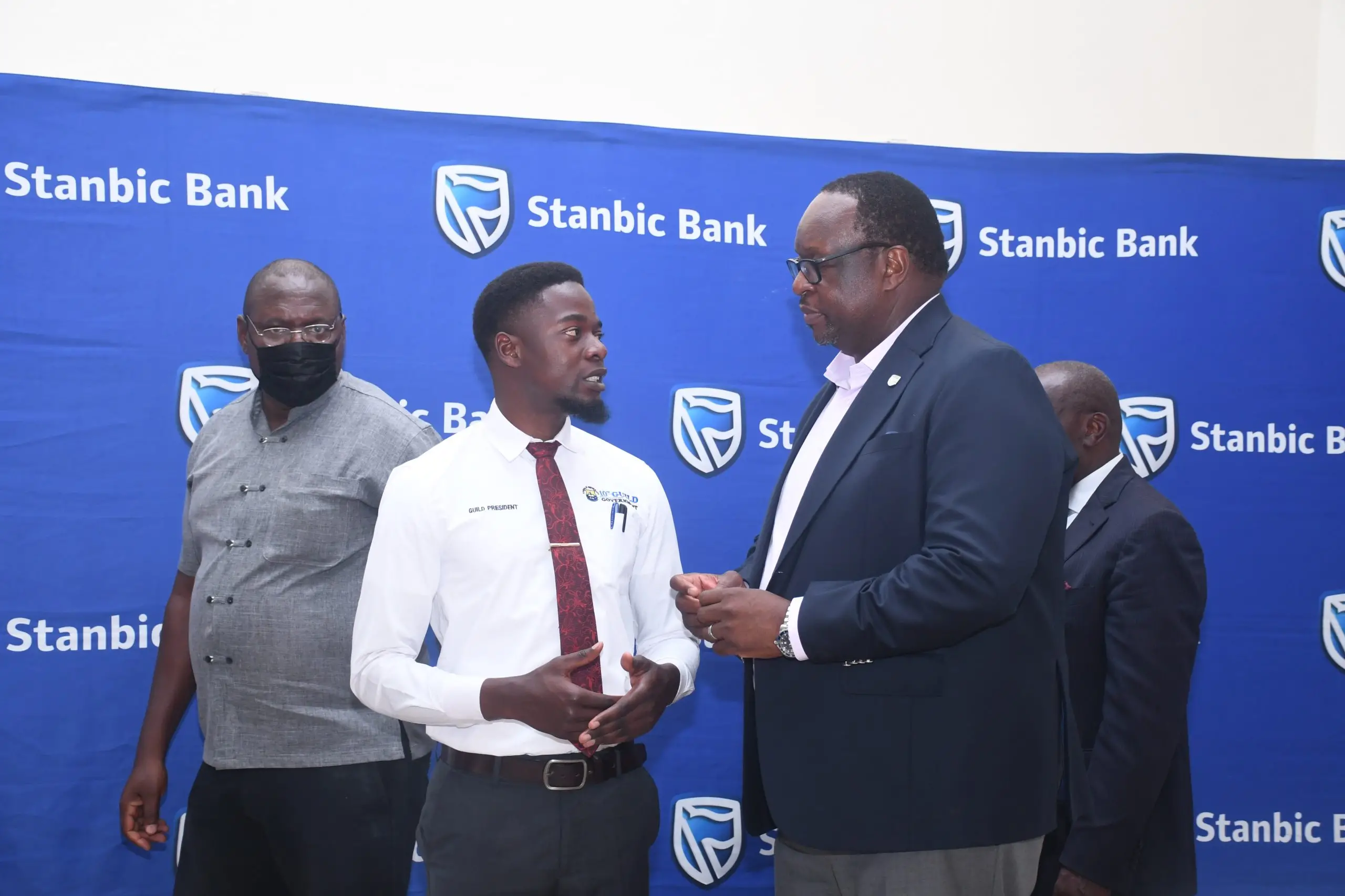 Stanbic Bank's Chief Executive Mumba Kalifungwa sharing light moments with Kabale University Guild President Justus Drake Kyarikunda (1) Stanbic Bank's Chief Executive Mumba Kalifungwa sharing light moments with Kabale University Guild President Justus Drake Kyarikunda (1)